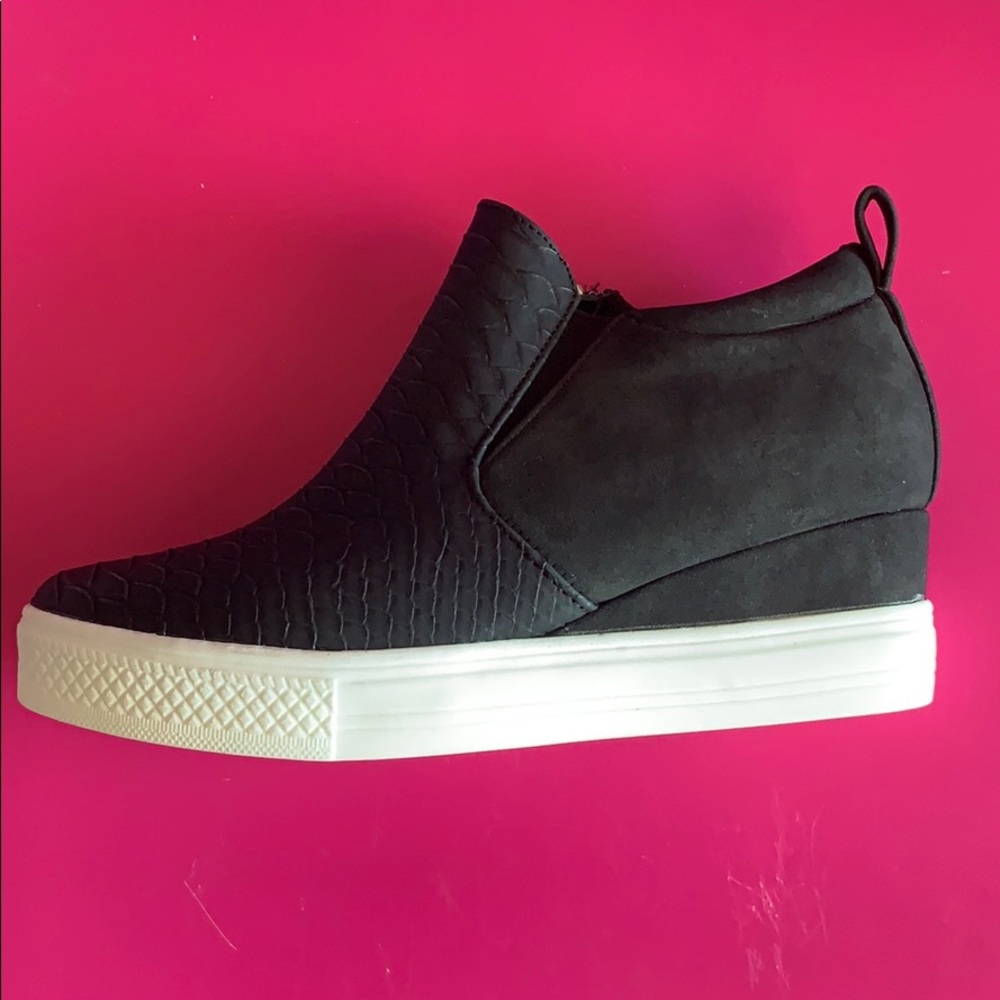 Black snake skin embossed sneakers.